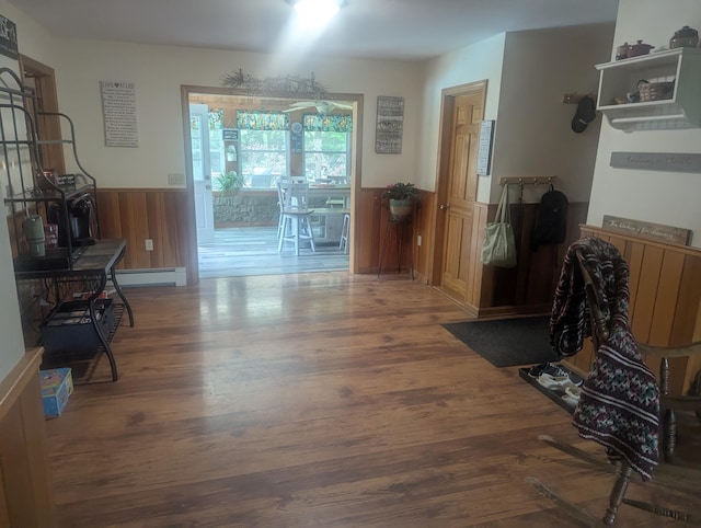 9 Deer Hill Ln, Hampden, ME 04444 - dining room with wood finished floors, a wainscoted wall, and a baseboard heating unit