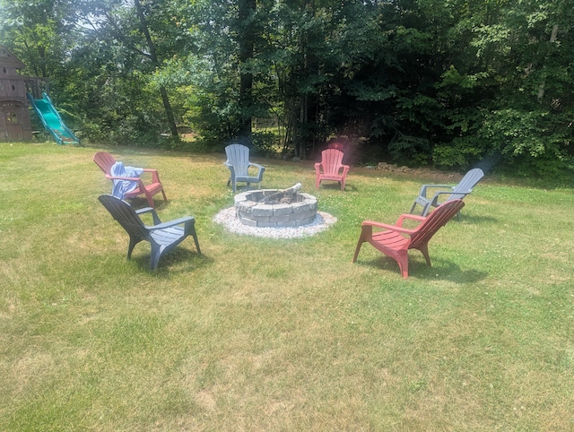 9 Deer Hill Ln, Hampden, ME 04444 - view of green lawn featuring an outdoor fire pit and a playground