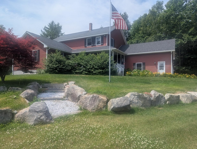 9 Deer Hill Ln, Hampden, ME 04444 - back of property with a lawn and a chimney