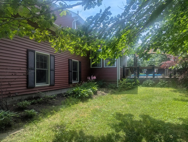 9 Deer Hill Ln, Hampden, ME 04444 - view of green lawn with a deck