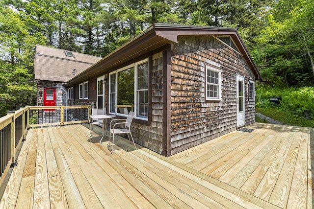 490 Cross Point Rd, Edgecomb, ME 04556 - wooden terrace with view of wooded area