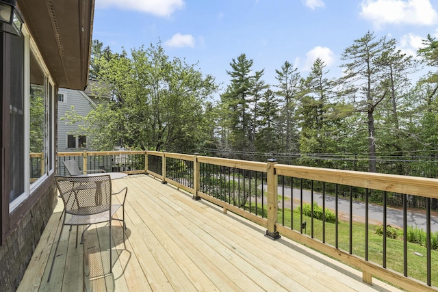 490 Cross Point Rd, Edgecomb, ME 04556 - wooden terrace with view of scattered trees