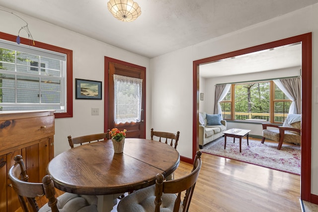 490 Cross Point Rd, Edgecomb, ME 04556 - dining area with light wood-style floors and baseboards
