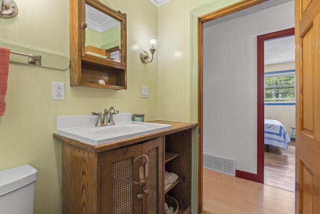 490 Cross Point Rd, Edgecomb, ME 04556 - half bath with wood finished floors and vanity