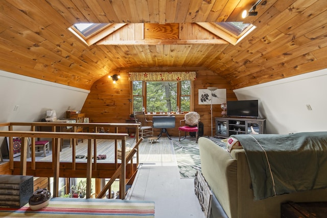 490 Cross Point Rd, Edgecomb, ME 04556 - living area with a skylight, wooden ceiling, wooden walls, vaulted ceiling, and wood finished floors
