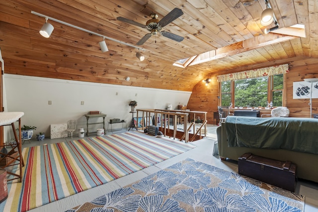 490 Cross Point Rd, Edgecomb, ME 04556 - recreation room with wooden ceiling, track lighting, a skylight, wood walls, and a ceiling fan
