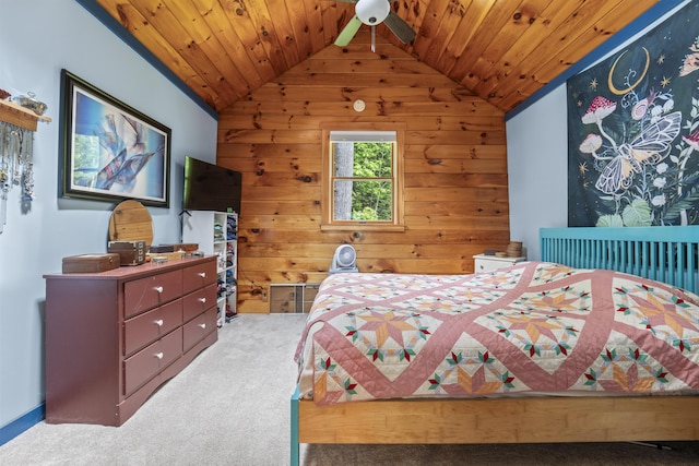 490 Cross Point Rd, Edgecomb, ME 04556 - bedroom featuring vaulted ceiling, carpet flooring, wood walls, and wood ceiling