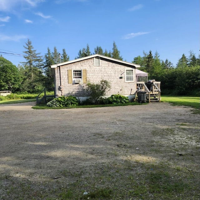 96 N Main St, Milbridge, ME 04658 - view of side of home featuring a deck