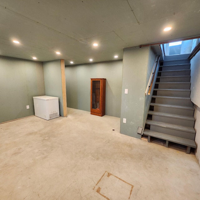 96 N Main St, Milbridge, ME 04658 - finished basement with stairs, recessed lighting, and refrigerator