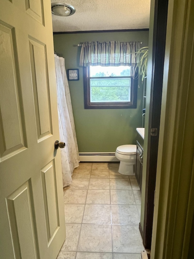 96 N Main St, Milbridge, ME 04658 - bathroom featuring a baseboard heating unit, vanity, a textured ceiling, and curtained shower