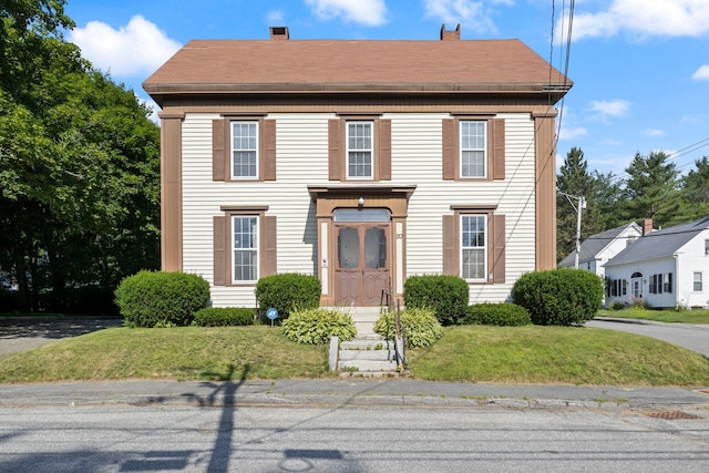 20 Winter St, Augusta, ME 04330 - view of front of home with a front lawn, a shingled roof, and a chimney