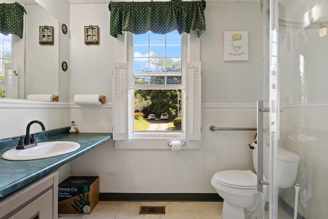 20 Winter St, Augusta, ME 04330 - bathroom featuring vanity, a shower with door, and tile patterned floors