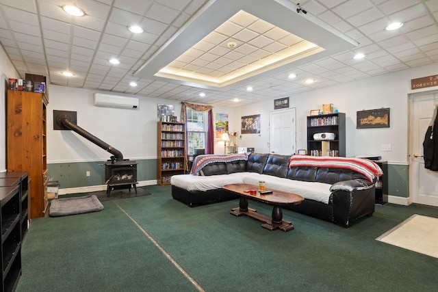 20 Winter St, Augusta, ME 04330 - carpeted living area featuring a wood stove, a wall mounted AC, and recessed lighting