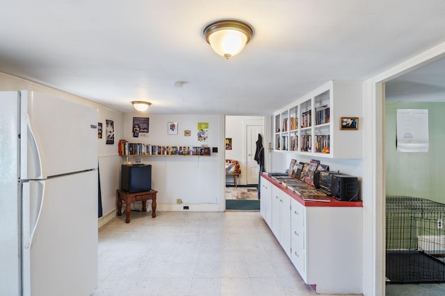 20 Winter St, Augusta, ME 04330 - kitchen featuring freestanding refrigerator and white cabinetry