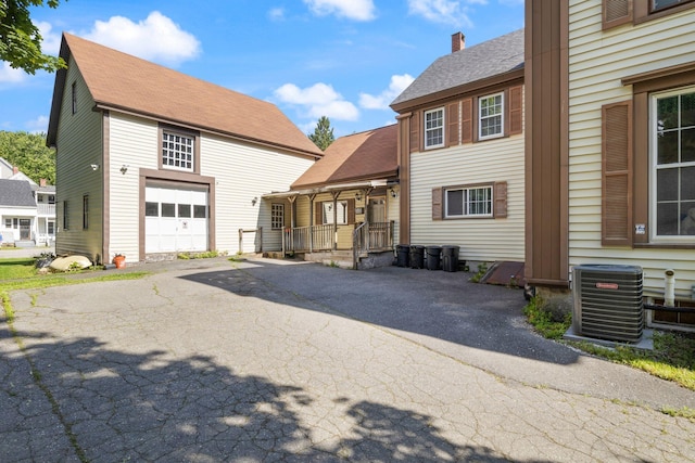 20 Winter St, Augusta, ME 04330 - view of front of home featuring asphalt driveway and a shingled roof