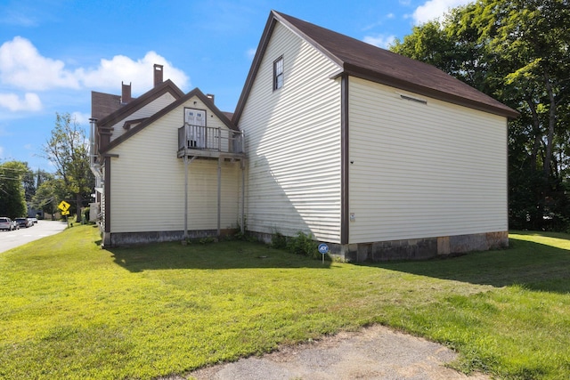 20 Winter St, Augusta, ME 04330 - view of side of home with a balcony, a lawn, and a chimney