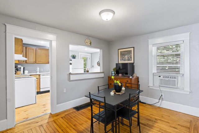 68 Newbury St, Auburn, ME 04210 - dining room with light wood-style flooring and cooling unit