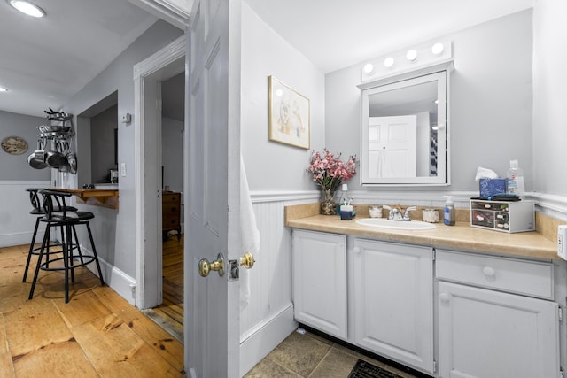 68 Newbury St, Auburn, ME 04210 - bathroom featuring wainscoting and vanity