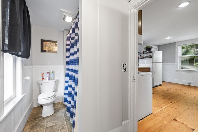 68 Newbury St, Auburn, ME 04210 - full bath featuring washer / clothes dryer, wainscoting, a shower with shower curtain, and wood finished floors