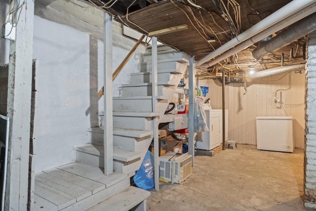 68 Newbury St, Auburn, ME 04210 - unfinished basement featuring washer / clothes dryer, refrigerator, and stairs