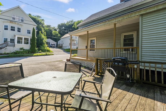 68 Newbury St, Auburn, ME 04210 - porch with outdoor dining space, a grill, and a residential view