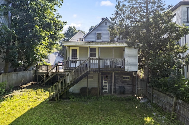 68 Newbury St, Auburn, ME 04210 - back of property with stairway, a fenced backyard, and covered porch