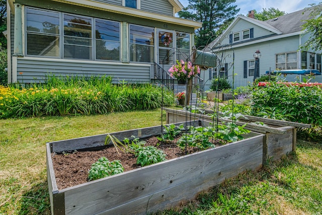 42 Sargent St, Westbrook, ME 04092 - back of house with a garden, a yard, and a sunroom