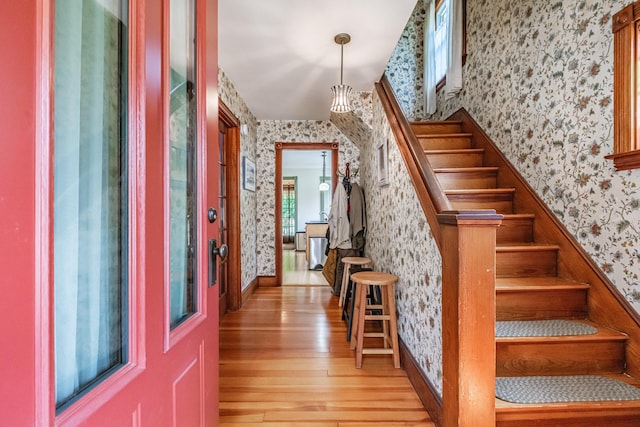 42 Sargent St, Westbrook, ME 04092 - foyer featuring wallpapered walls, light wood-style floors, and stairway