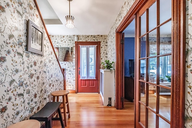 42 Sargent St, Westbrook, ME 04092 - foyer with wallpapered walls and light wood-style flooring