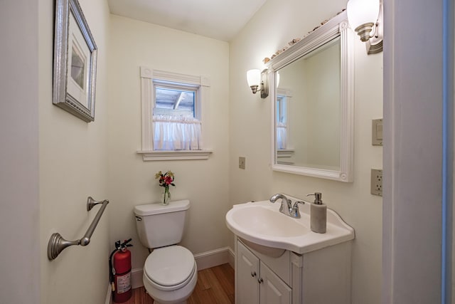 42 Sargent St, Westbrook, ME 04092 - half bath featuring vanity and wood finished floors