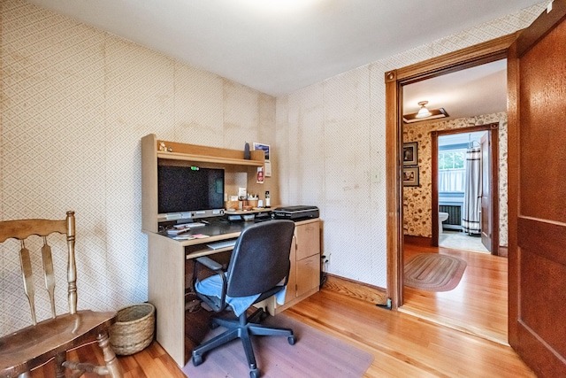 42 Sargent St, Westbrook, ME 04092 - office area featuring wallpapered walls and light wood finished floors