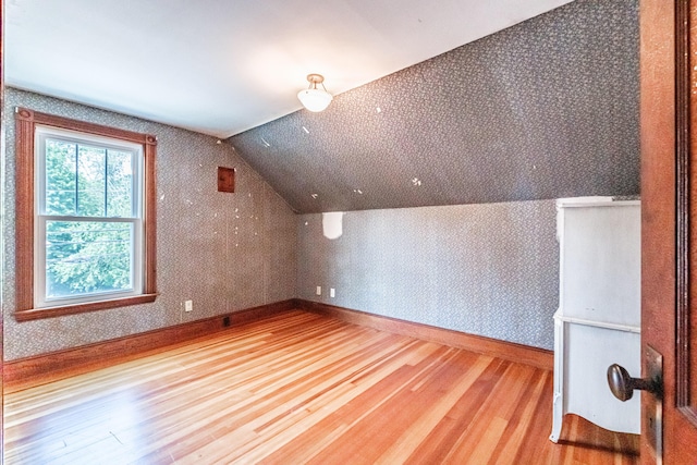42 Sargent St, Westbrook, ME 04092 - additional living space with wood finished floors, wallpapered walls, and vaulted ceiling