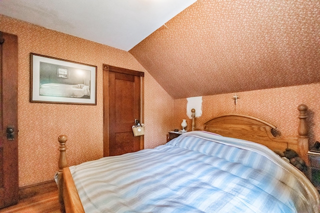 42 Sargent St, Westbrook, ME 04092 - bedroom featuring vaulted ceiling, wallpapered walls, and wood finished floors