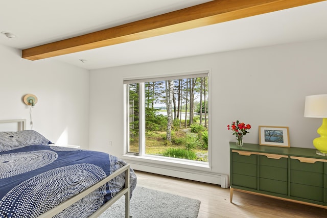 133 Scraggle Point Rd, Saint George, ME 04859 - bedroom featuring baseboard heating, beamed ceiling, wood finished floors, and a water view