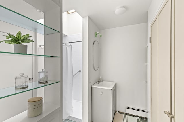 133 Scraggle Point Rd, Saint George, ME 04859 - full bathroom featuring baseboard heating and curtained shower