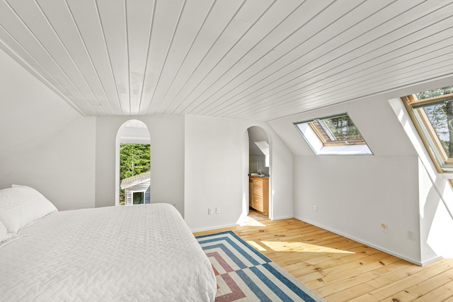 133 Scraggle Point Rd, Saint George, ME 04859 - bedroom featuring multiple windows, light wood finished floors, wood ceiling, and lofted ceiling
