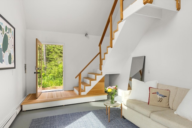 133 Scraggle Point Rd, Saint George, ME 04859 - living room featuring stairway, baseboard heating, and vaulted ceiling