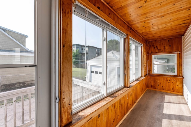 19 Fall St, Biddeford, ME 04005 - unfurnished sunroom featuring healthy amount of natural light, wood finished floors, wood ceiling, and wood walls