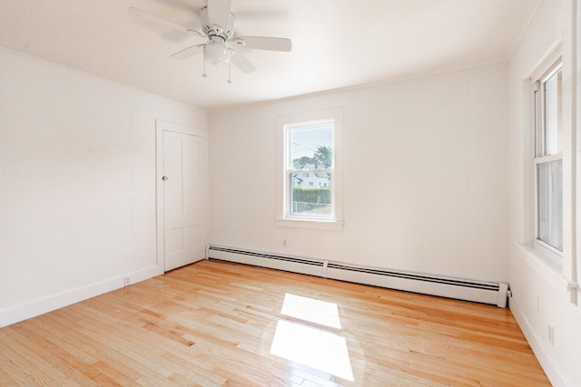 19 Fall St, Biddeford, ME 04005 - spare room featuring baseboard heating, wood finished floors, a ceiling fan, and crown molding