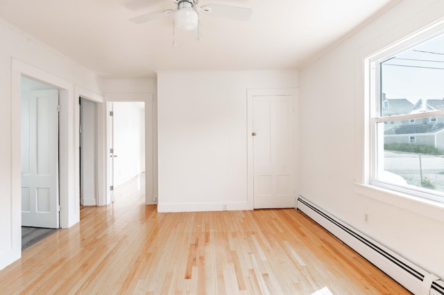 19 Fall St, Biddeford, ME 04005 - unfurnished room with a baseboard heating unit, light wood-type flooring, crown molding, and ceiling fan