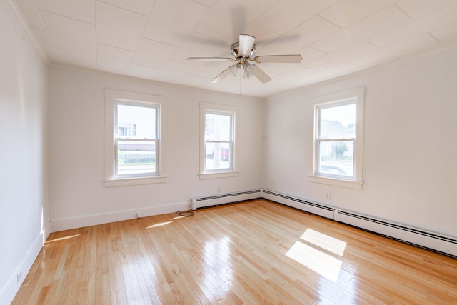 19 Fall St, Biddeford, ME 04005 - empty room featuring wood-type flooring, baseboard heating, and a ceiling fan