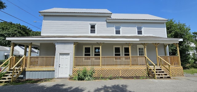 158 Water St, Waterville, ME 04901 - view of front of home with a porch, stairway, and a metal roof