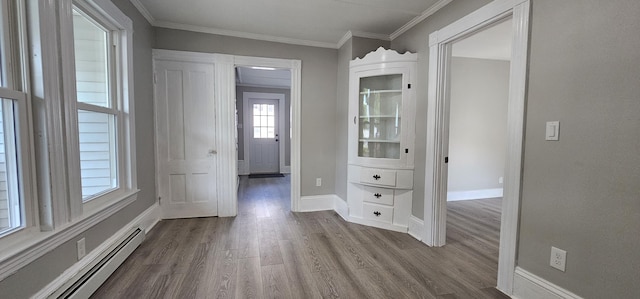 158 Water St, Waterville, ME 04901 - corridor with baseboard heating, wood finished floors, and ornamental molding