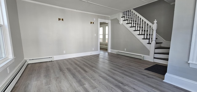 158 Water St, Waterville, ME 04901 - unfurnished living room featuring baseboard heating, stairway, wood finished floors, and crown molding