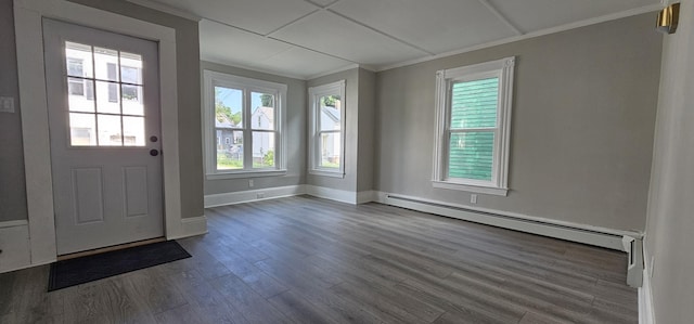 158 Water St, Waterville, ME 04901 - foyer entrance featuring baseboard heating, dark wood finished floors, and crown molding