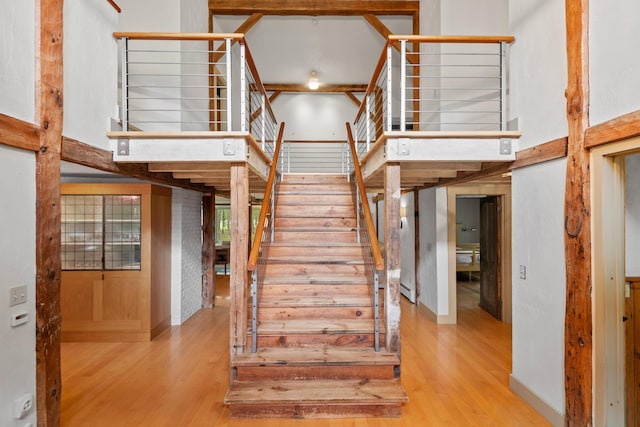 372 Bald Head Rd, Arrowsic, ME 04530 - stairway featuring wood finished floors and a towering ceiling