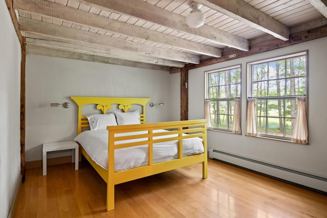 372 Bald Head Rd, Arrowsic, ME 04530 - bedroom featuring a baseboard radiator, a wood ceiling with exposed beams, and hardwood / wood-style flooring