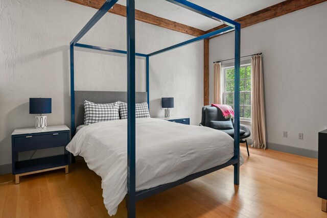 372 Bald Head Rd, Arrowsic, ME 04530 - bedroom featuring wood finished floors and beam ceiling