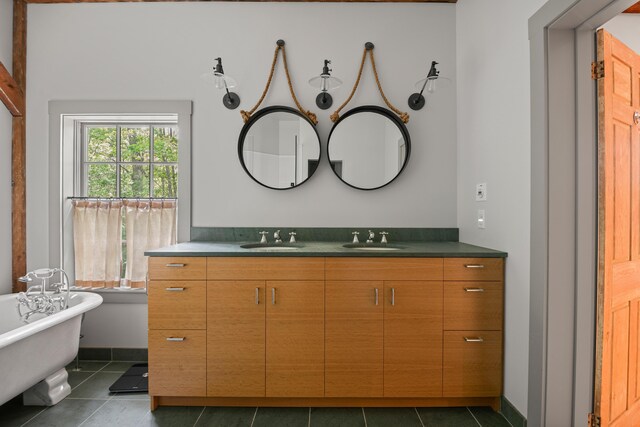 372 Bald Head Rd, Arrowsic, ME 04530 - full bathroom with double vanity, a freestanding tub, and tile patterned flooring