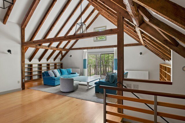 372 Bald Head Rd, Arrowsic, ME 04530 - living room with beam ceiling, wood finished floors, and high vaulted ceiling